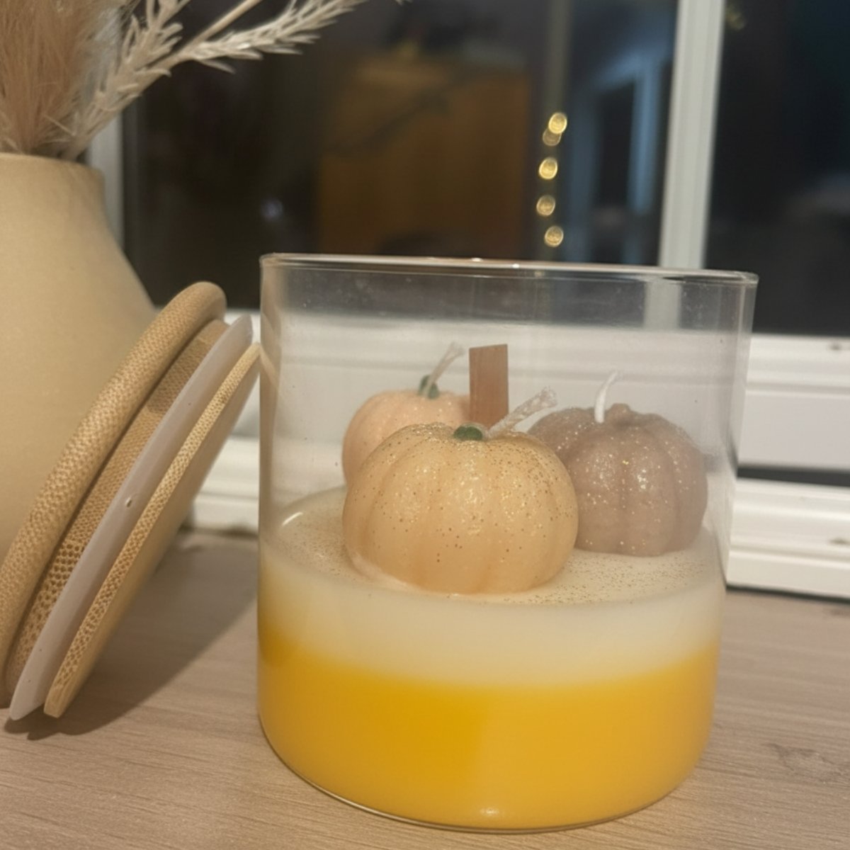 Pumpkin-Shaped autumn harvest candle cap standing with jar and candles in multi-colored