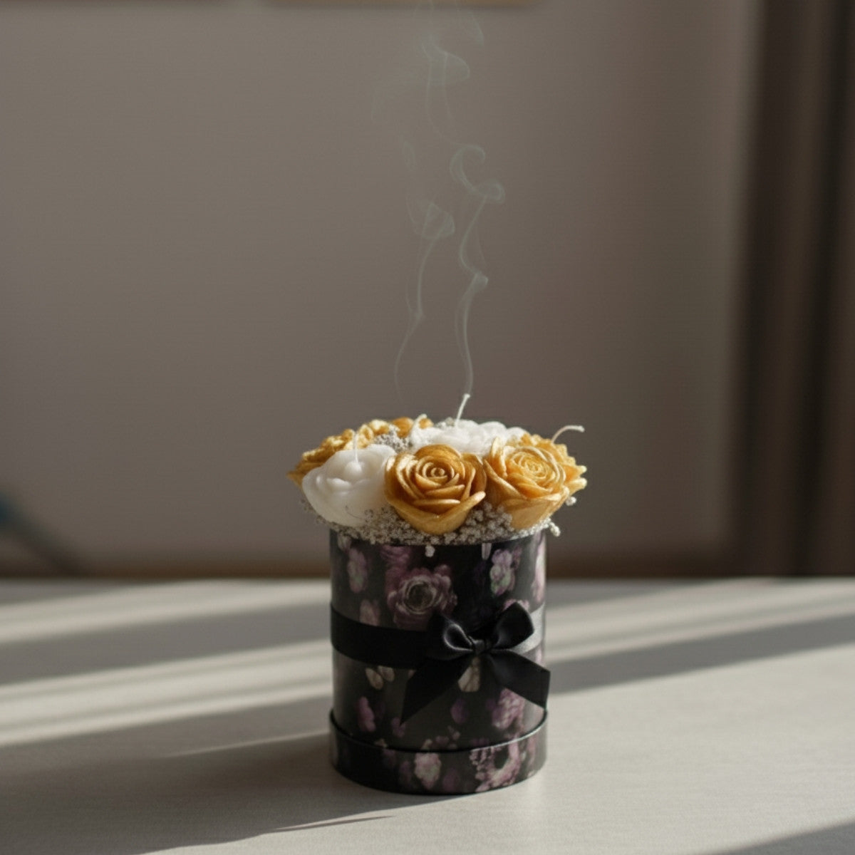 Small golden candle bouquet with hand-poured flower-shaped candles in an elegant gift box