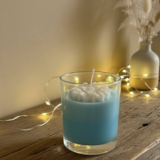 Radiance duo-tone soy candle in sky blue and white with sunflower-inspired design, hand-poured decorative candle.